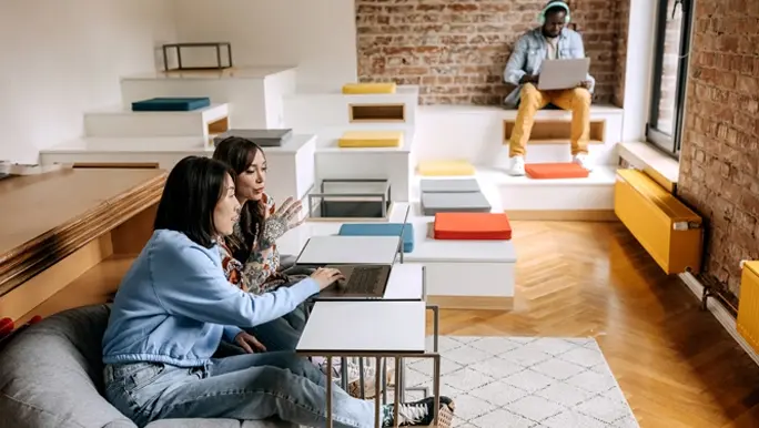 Office workers in a collaborative breakout space