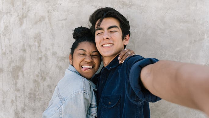 Teenage couple taking a selfie