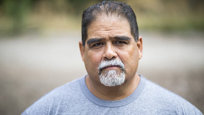 A man stares into the camera, he looks serious and a little concerned. Perhaps about his gut bacteria and brain health? 