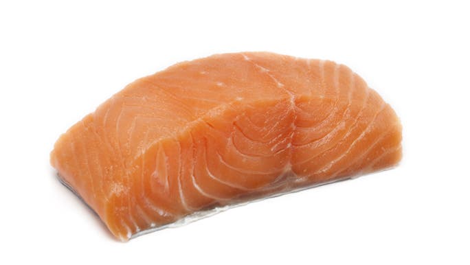 Raw salmon on a white background. 