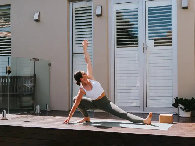 Zoe from 28 by Sam Wood stretching outside in active wear