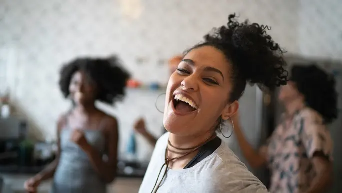 Friends dancing in the kitchen