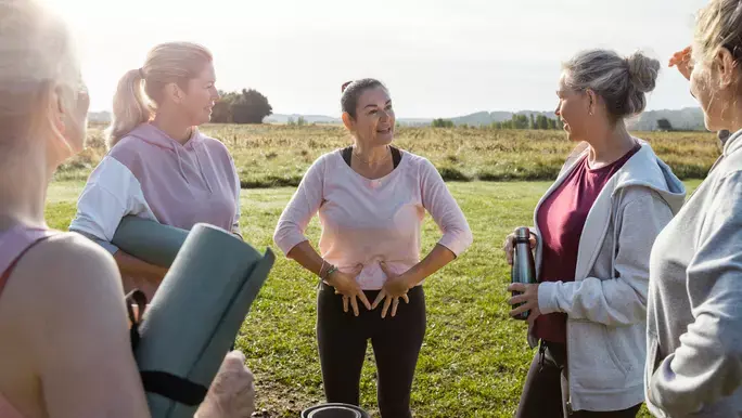 Group of mature women doing Yoga outdoors