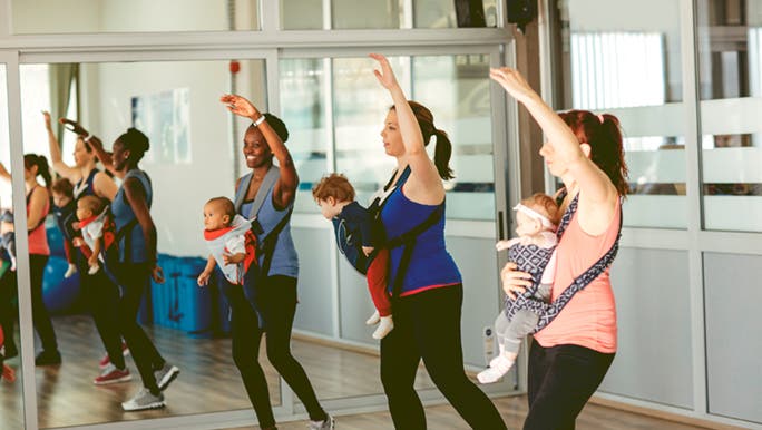 A group of women are in exercise class and are thinking about how to exercise while breastfeeding.