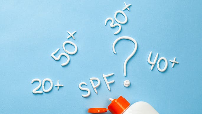 On a blue background, the SPF numbers are written in sunscreen, with an open bottle at the bottom.