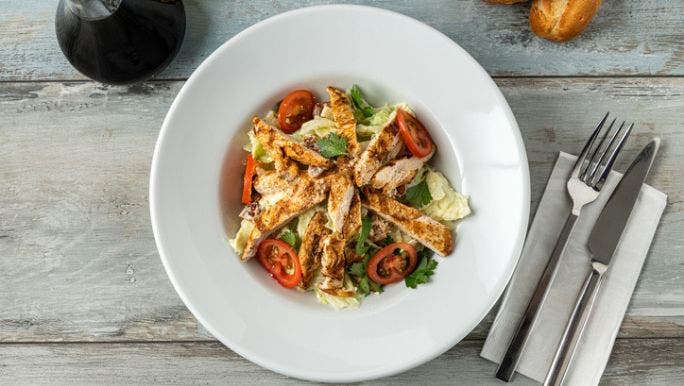 A flat lay image of a grilled chicken salad