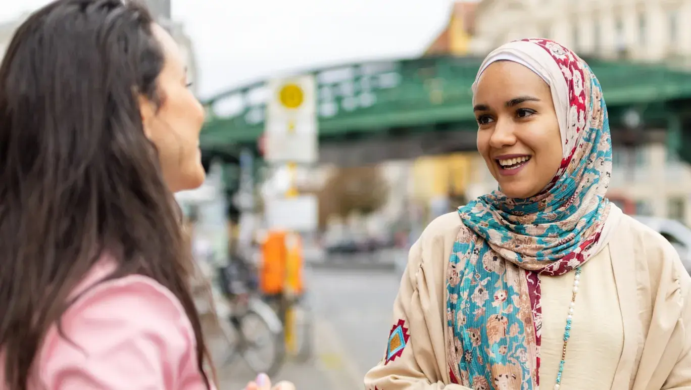 A woman talking to another woman