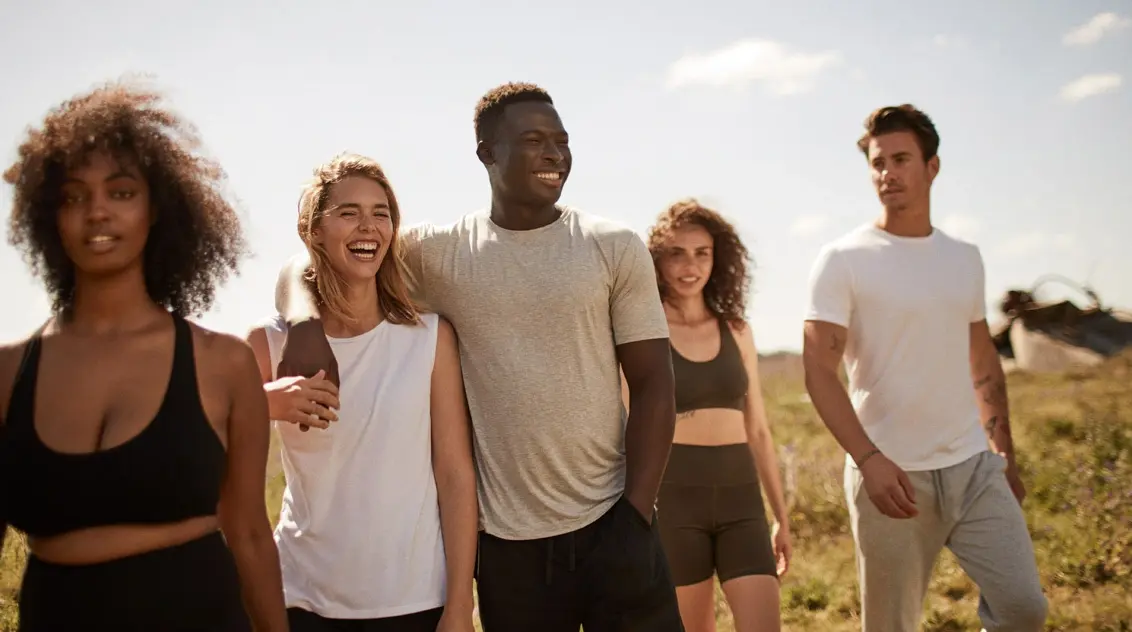 A group of people wearing the Boody Everyday range out in a field