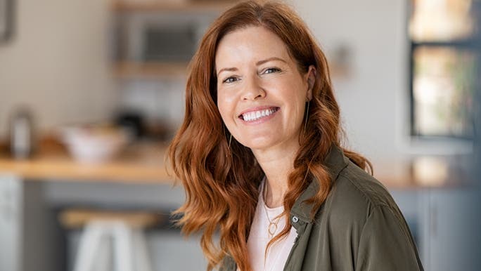 Woman with red hair smiling