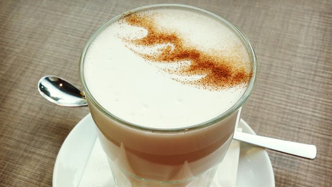 An image of a latte made out of vegan almond milk.