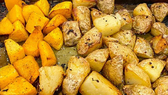 A tray of roast potato and pumpkin