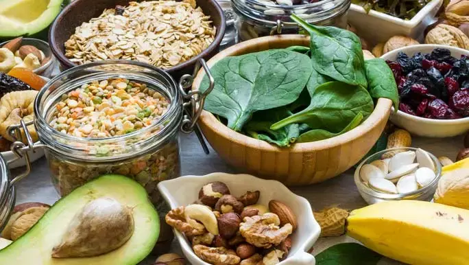 magnesium rich foods, bananas, spinach, nuts, grains, dried fruits, beans and avocado