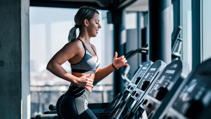 Woman running on a treadmill in an altitude gym