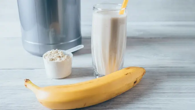 Pre-workout shake with protein powder and banana