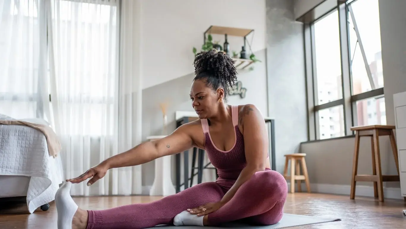 Women performing stretches at home
