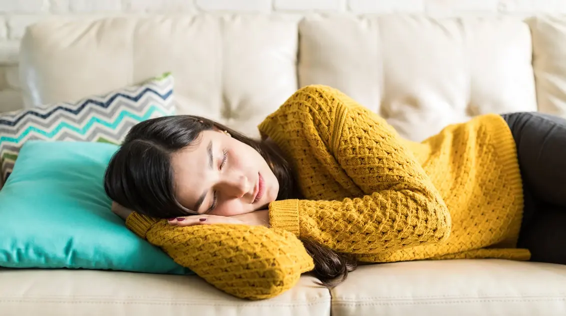 Woman sleeping on the couch