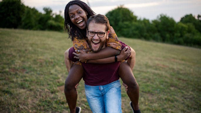Happy married couple enjoying time in the park together