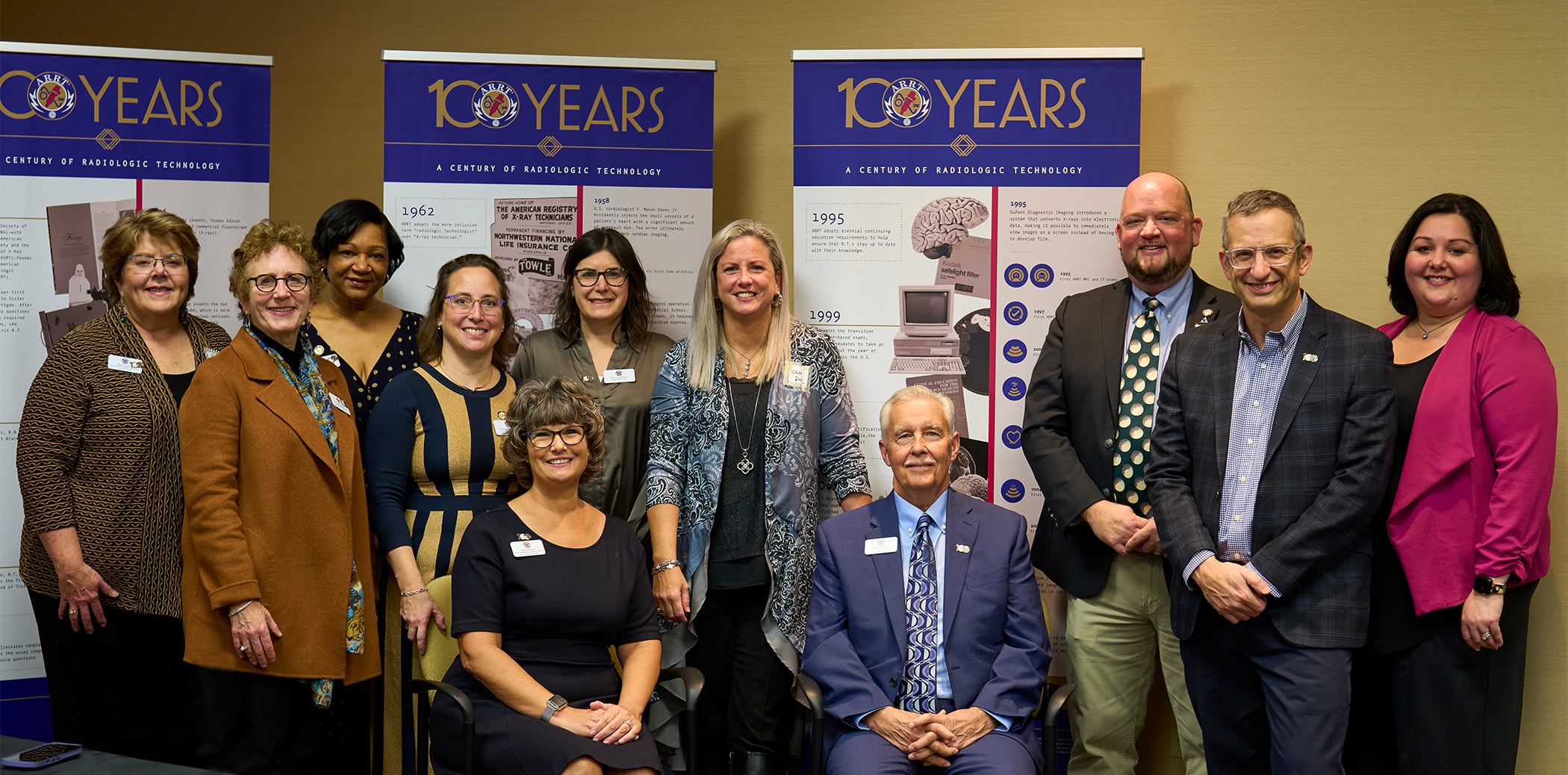 Photograph of the 2022 ARRT Board of Trustees - pictured with outgoing CEO Jerry B. Reid and incoming CEO Liana Watson - at the ARRT centennial celebration