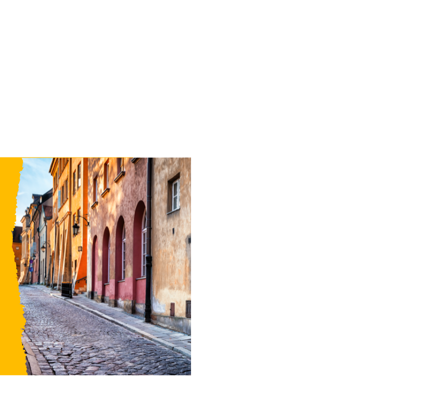 Cobbled street with colorful old buildings.