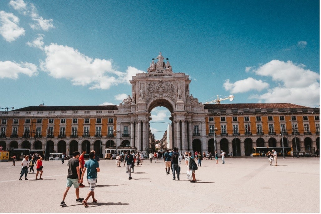 An archway stands tall in the Praça do Comércio in Lisbon, Portugal. 