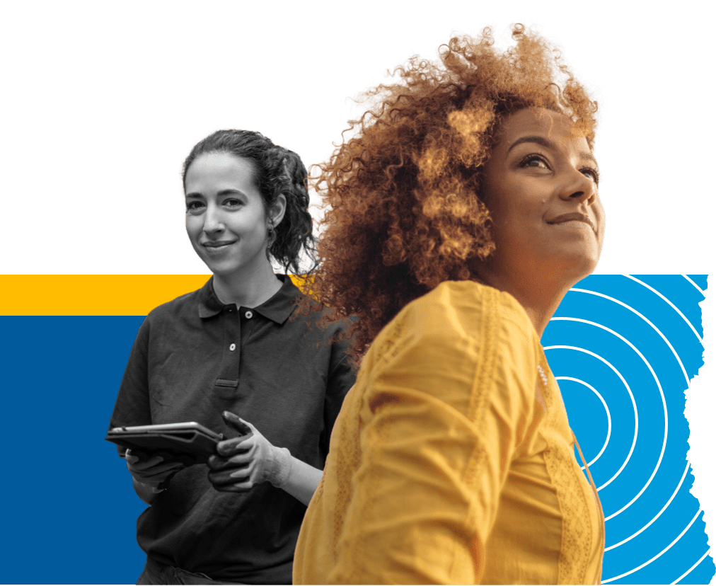 A woman in yellow blouse looking up. Another woman smiling at the background & holding a tablet. A woman in yellow blouse looking up. Another woman smiling at the background & holding a tablet.