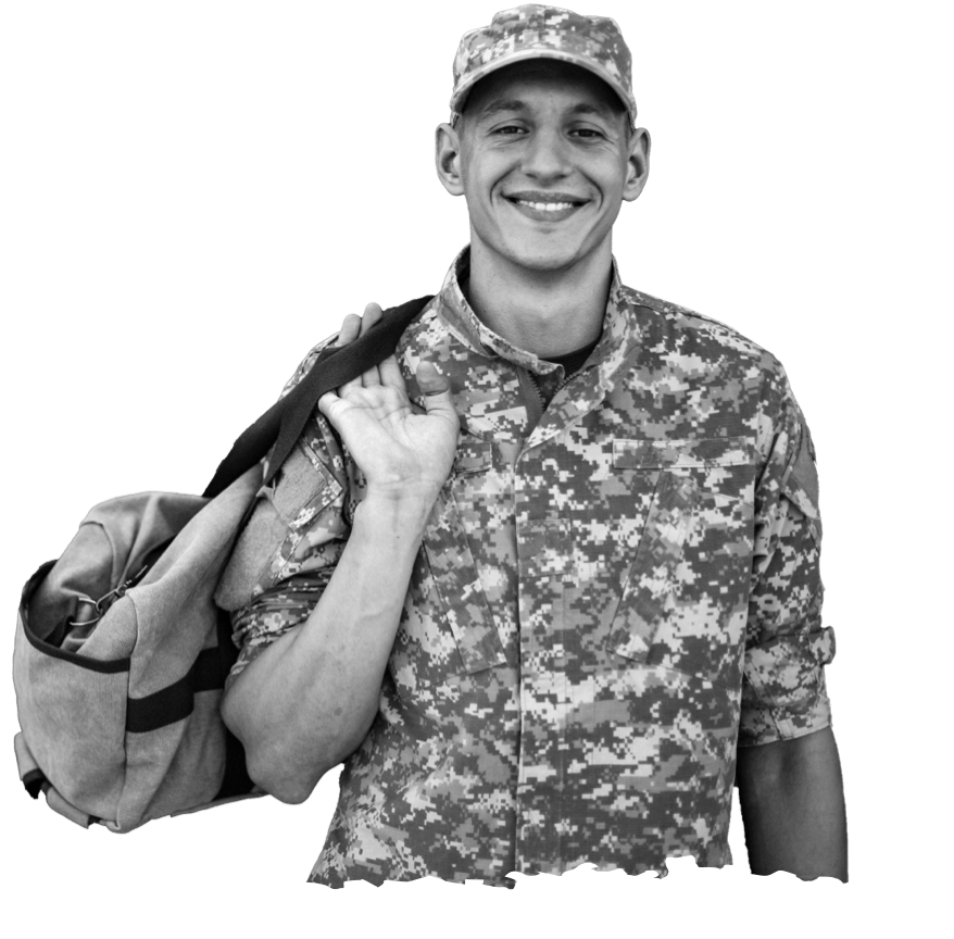 A smiling man in military uniform & holding a bag.