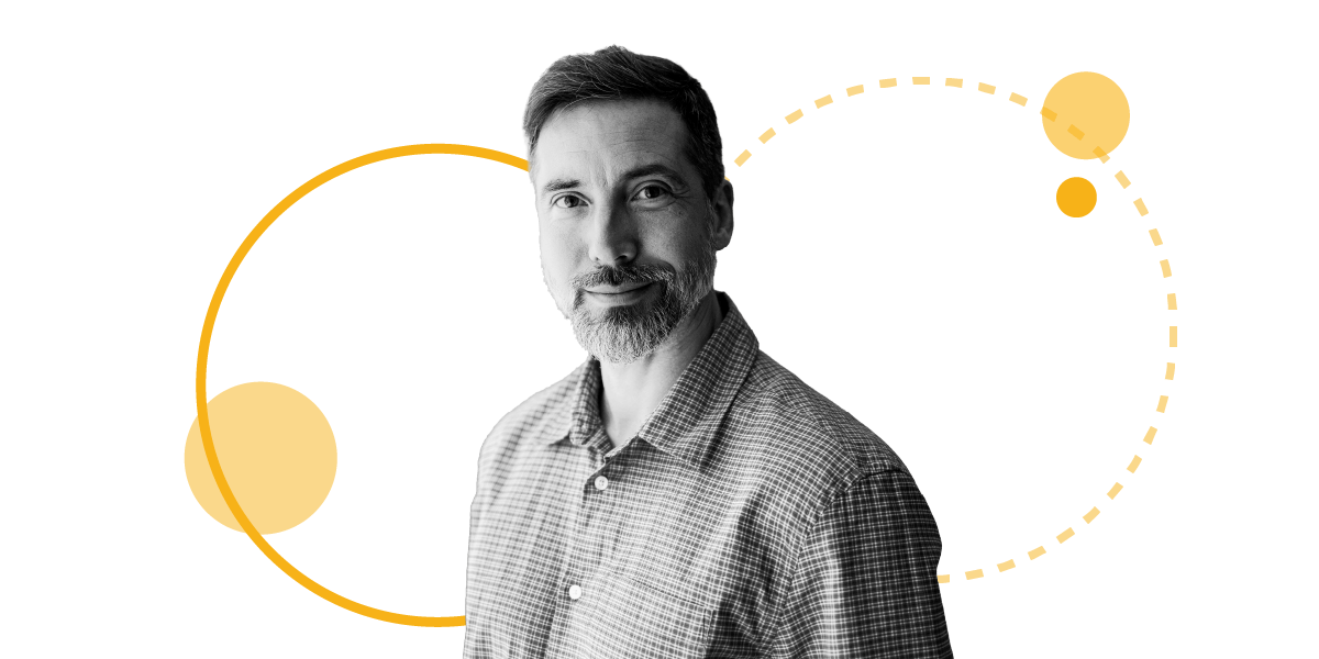 portrait of a business leader smiling with abstract graphic elements
