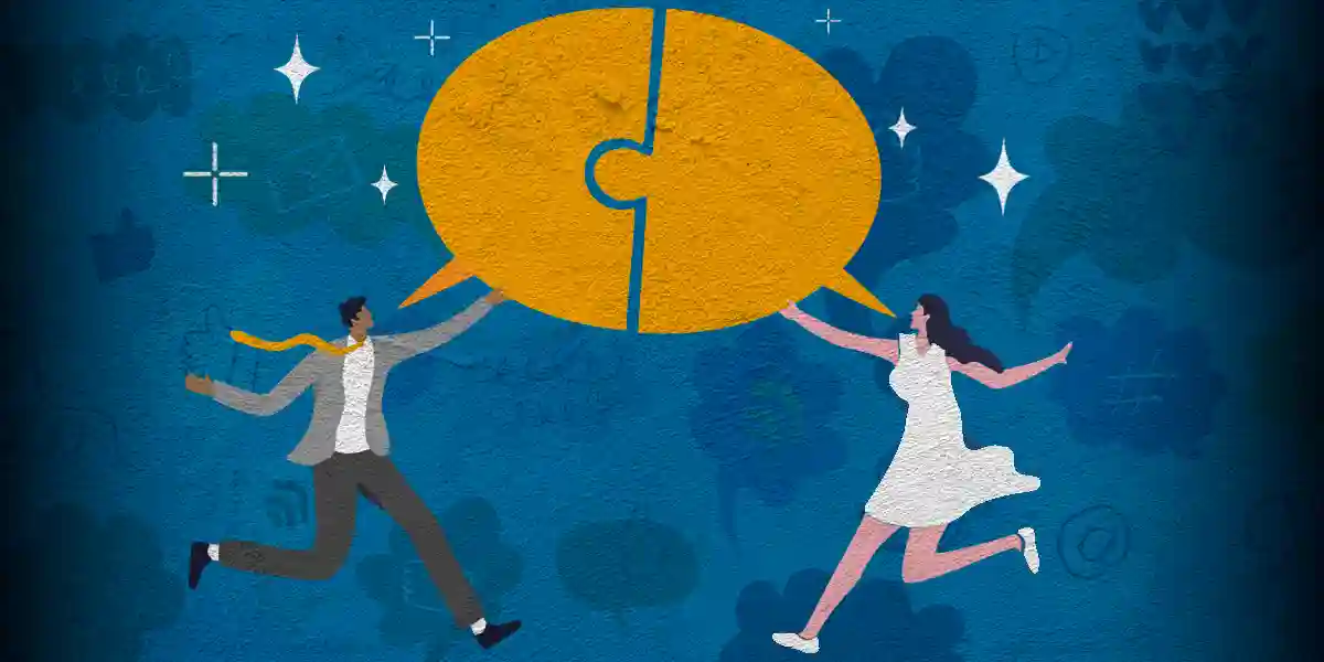 Deux personnes tenant une bulle de discussion partagée divisée en deux pièces de puzzle