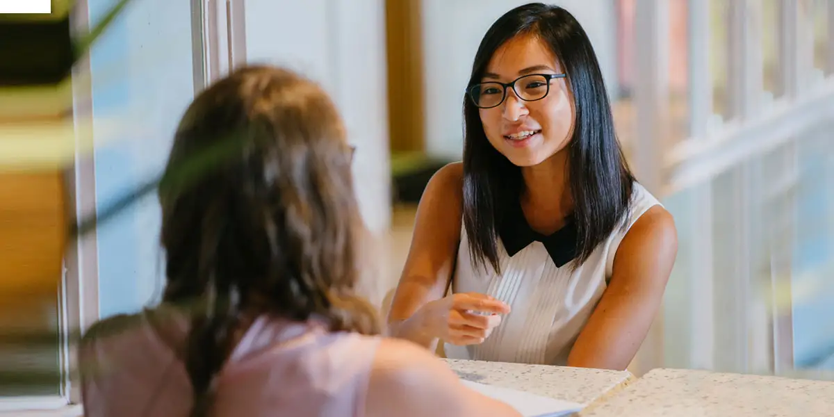 a woman interviewing another woman for a business-related job