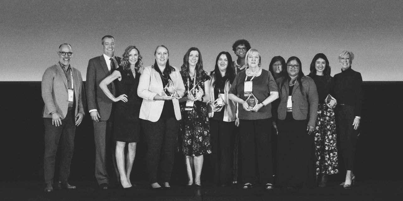 Black-and-white group photo of DDI's 2025 Customer Award Winners.
