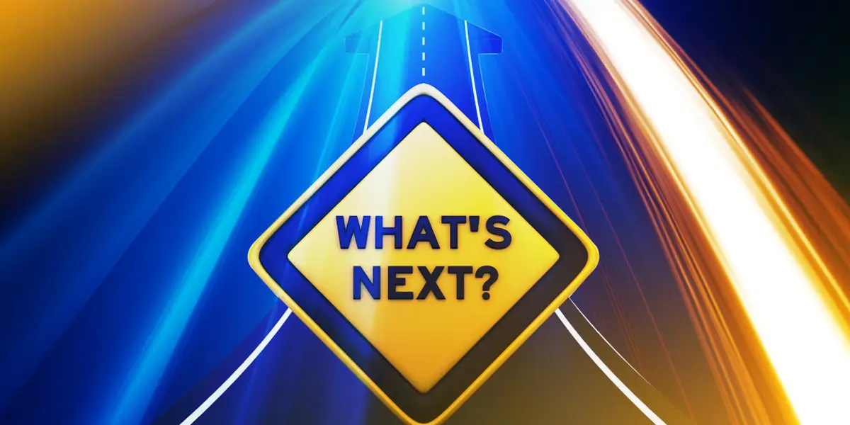 A street sign that says What's Next?