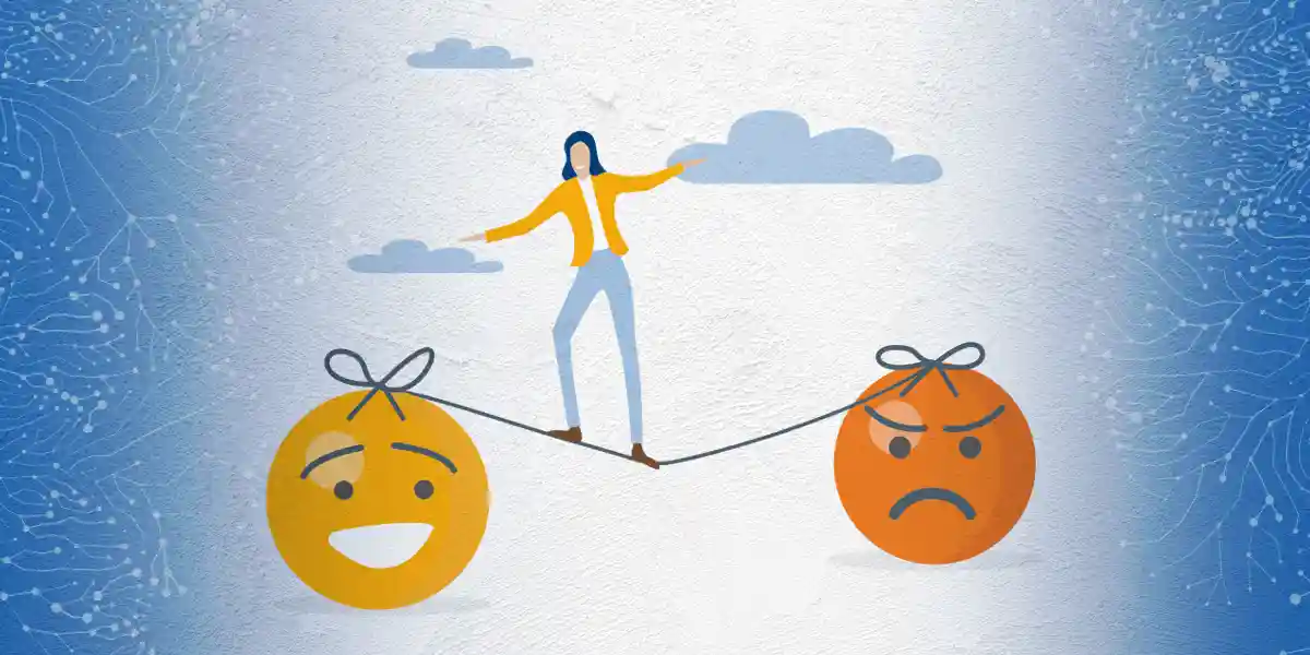 A woman balancing her emotions on a tight rope and she is leaning towards happy and peaceful over angry and sad.