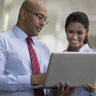 male and female colleagues having a discussion?fm=webp&q=65