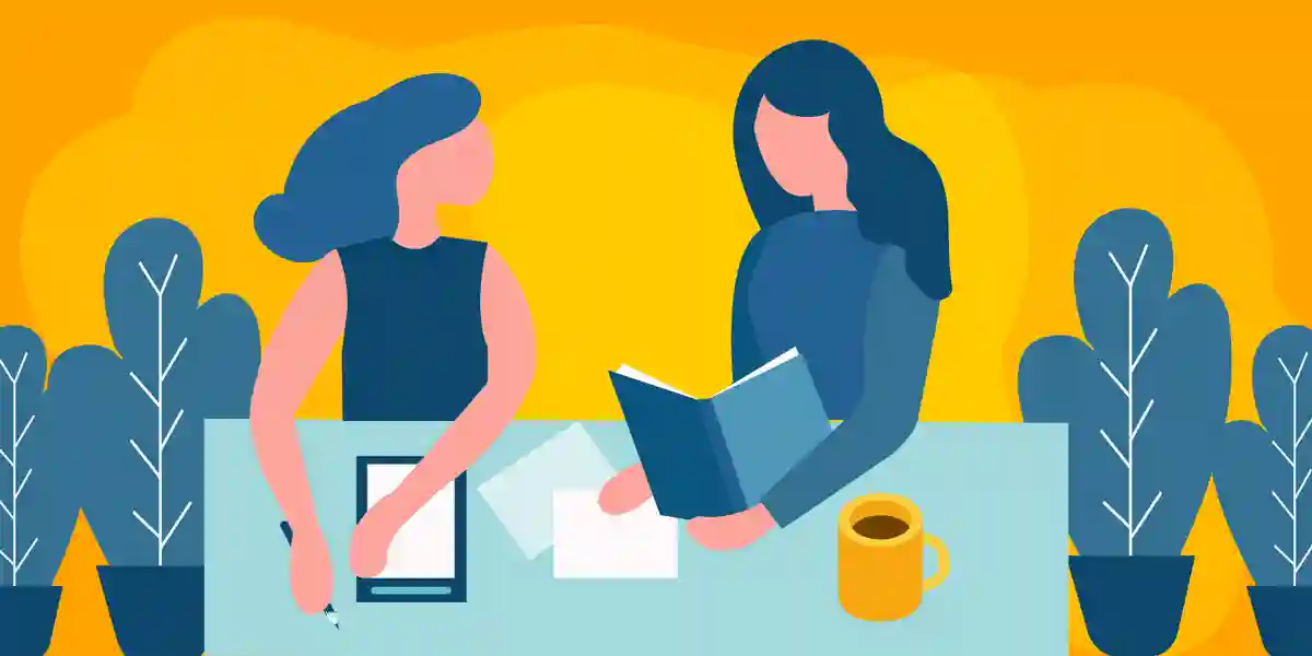 Un employé qui est coaché par un leader pour montrer ce blog explique pourquoi votre entreprise a besoin d’une culture de coaching et des conseils pour en créer une dans votre entreprise