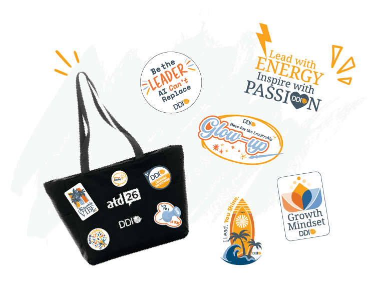 Black tote bag with DDI stickers and conference-themed graphics and slogans around it.?fm=webp&q=65