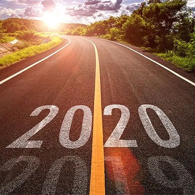 image of a road with 2020 written down the middle through the yellow line to show that the hot leadership topics of 2020 was one of our most-read leadership articles