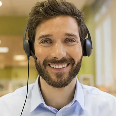 young professional man with a headset on