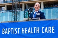 Mark Faulkner President and CEO, Baptist Health Care speaking at topping off beam celebration.