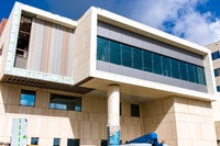 view of new section of building with windows and overhang.