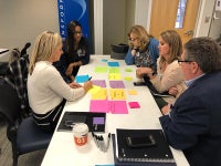 Team members discuss Transforming Baptist
