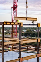 Cranes placing beams