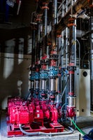 Liquid pumps with pipes attached.