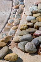 Stones being installed in park feature