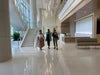 Team Members Stroll Hospital Concourse