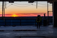 A sunset with workers present