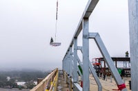 Crane bringing the beam into place