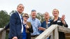 Mark Faulkner and a group looking up at the building
