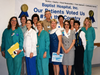 Group in front of voted number 1 patient satisfaction sign