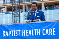 Guest speaking at topping off celebration.