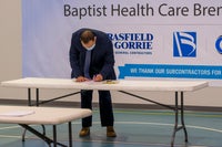 Man signing a document